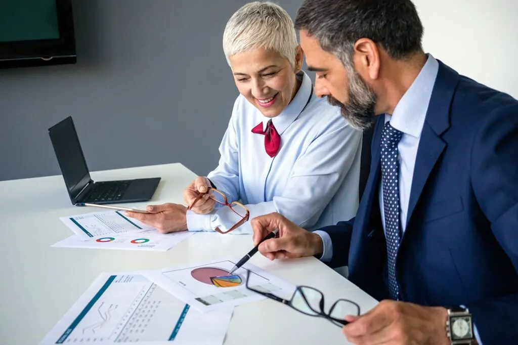 Brokers reviewing a transaction